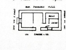 Portion of building on the first floor with garage